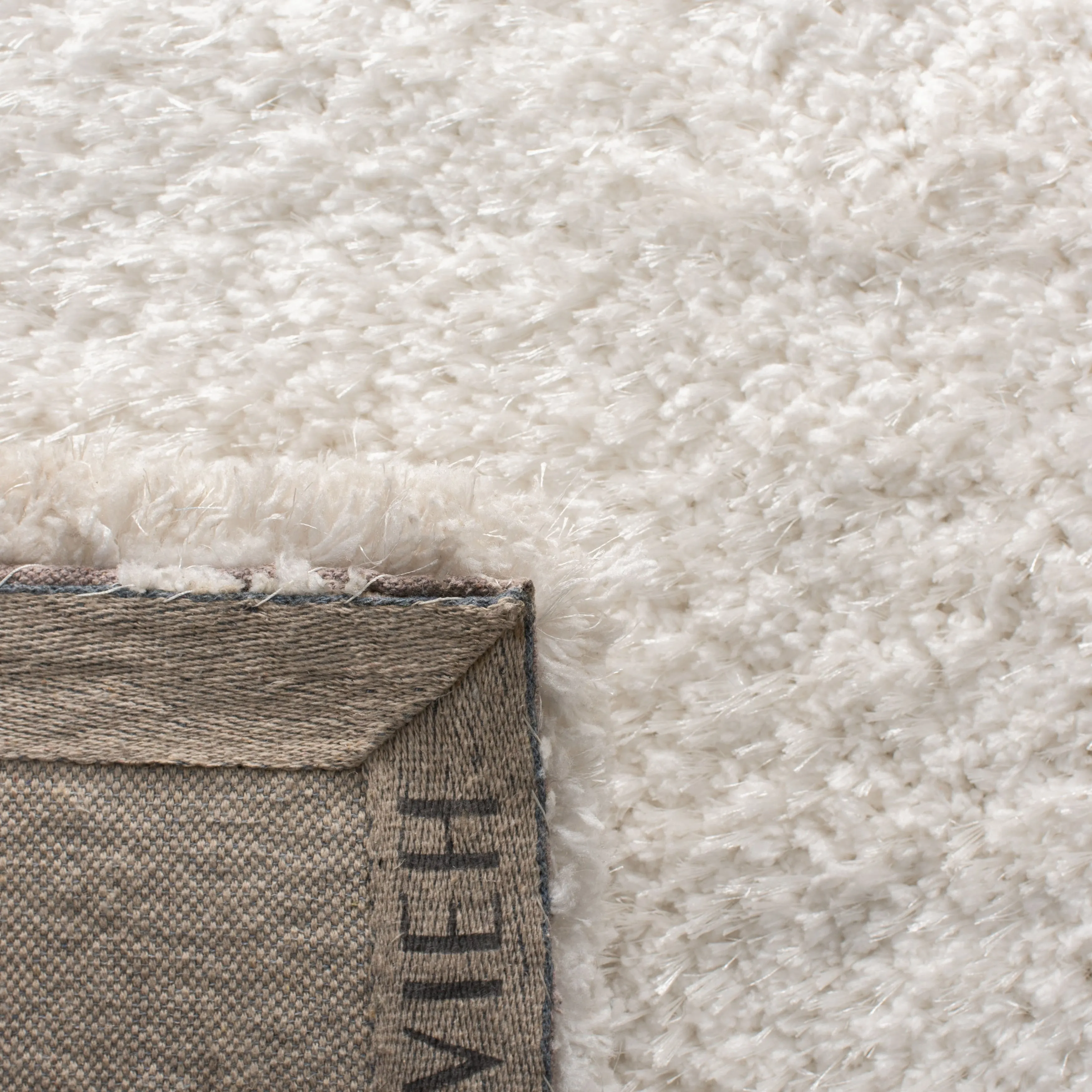 SAFAVIEH Handmade Ryann Shag Anneclaar Solid Polyester Rug