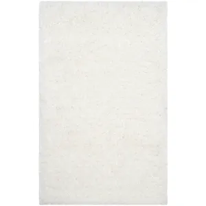 SAFAVIEH Handmade Ryann Shag Anneclaar Solid Polyester Rug