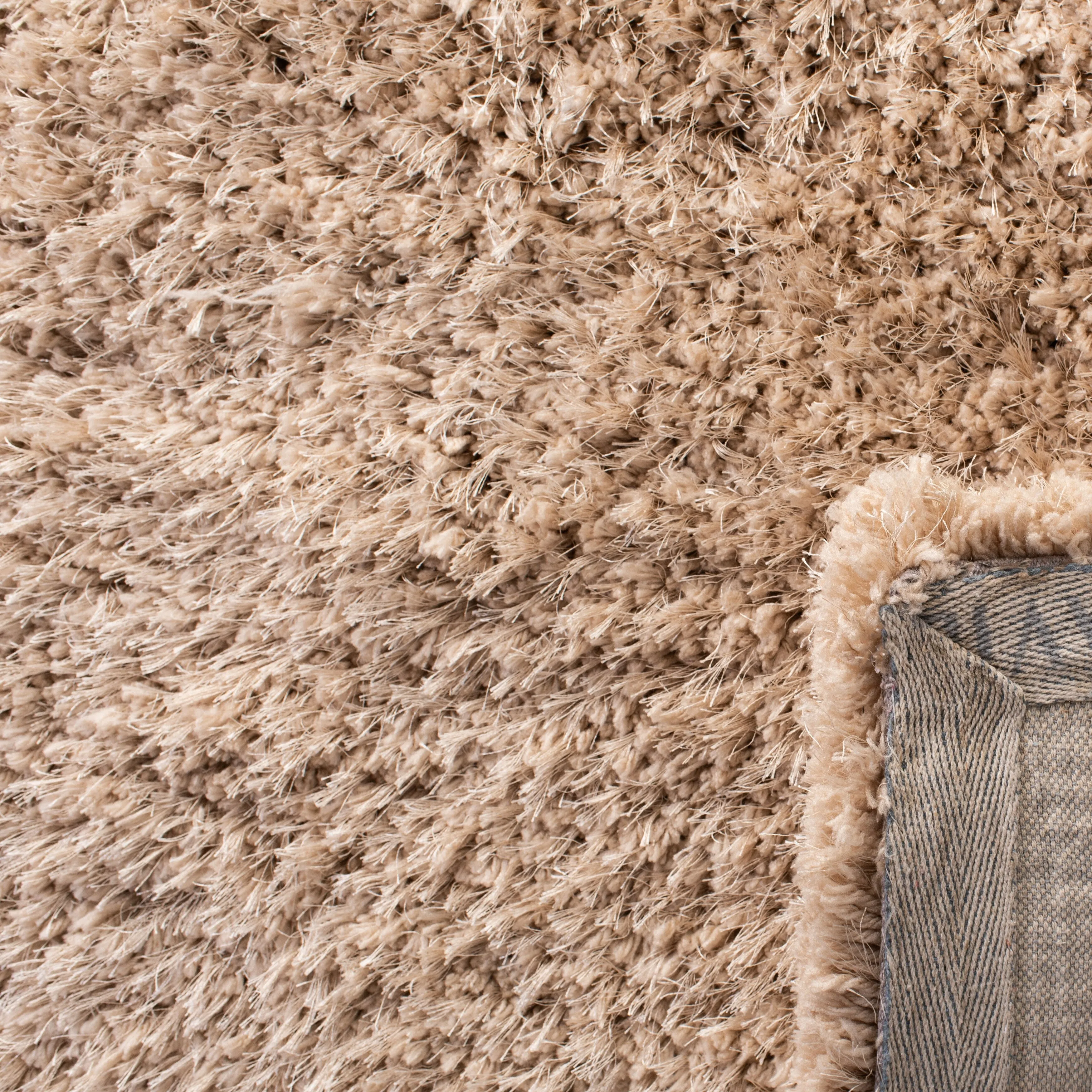 SAFAVIEH Handmade Ryann Shag Anneclaar Solid Polyester Rug