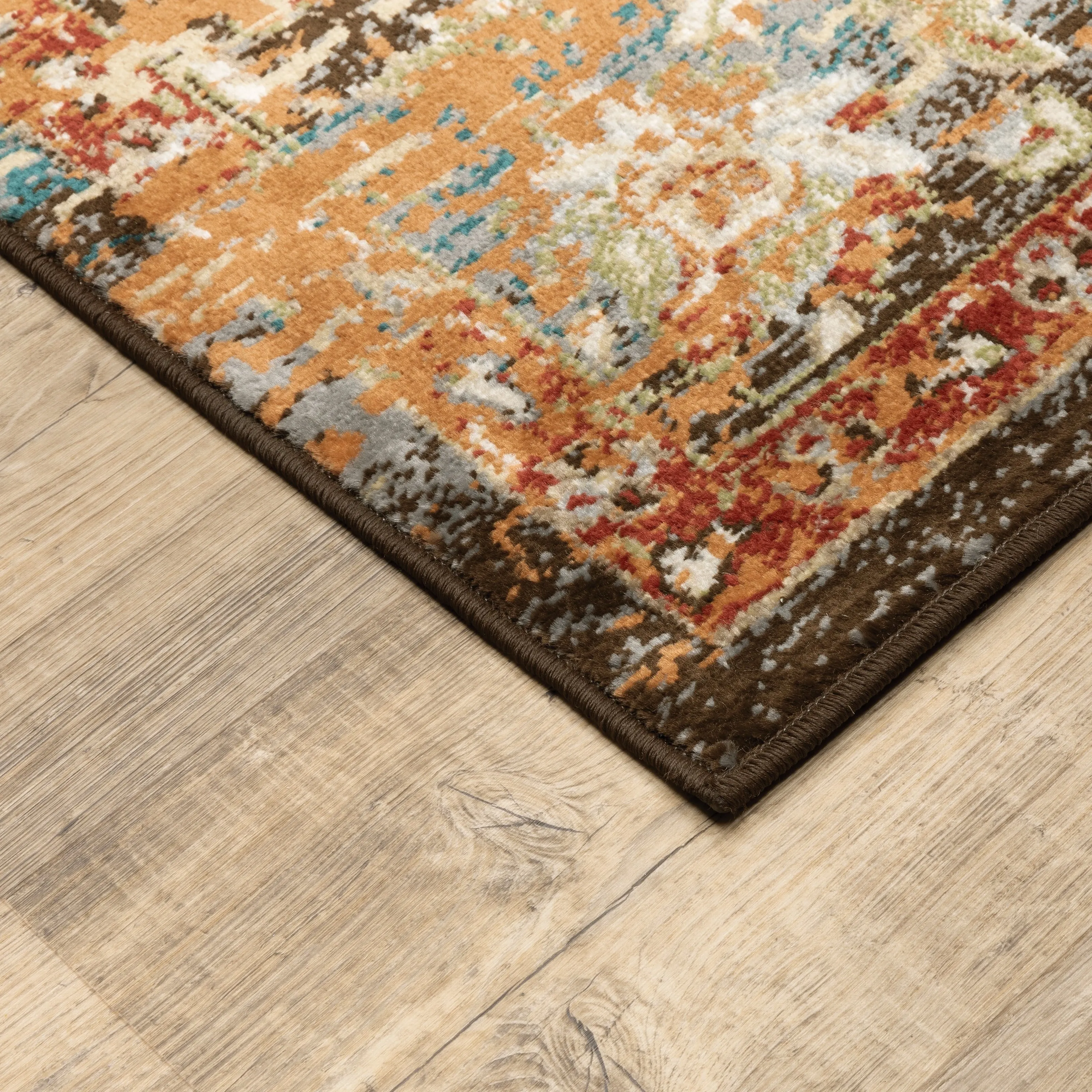 Vista Home Assen Goldtone/Orange Starburst Medallion Area Rug